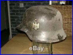 German ww2 helmet and a warning sign minen lebensgefahr