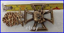 Skull with Iron Cross, oak leaves with swords Skull with Iron Cross, oak leaves with swords